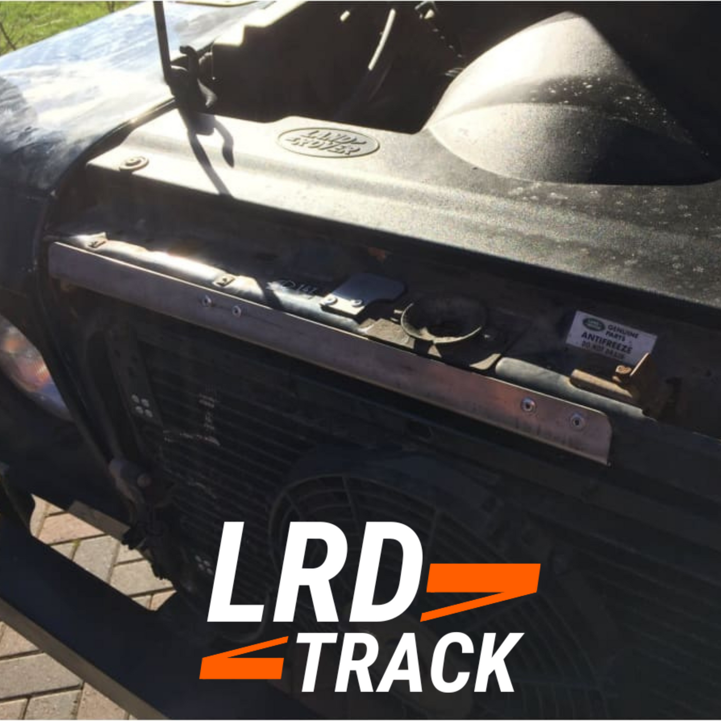 Defender bonnet cable guard fitted to a defender in the sunshine